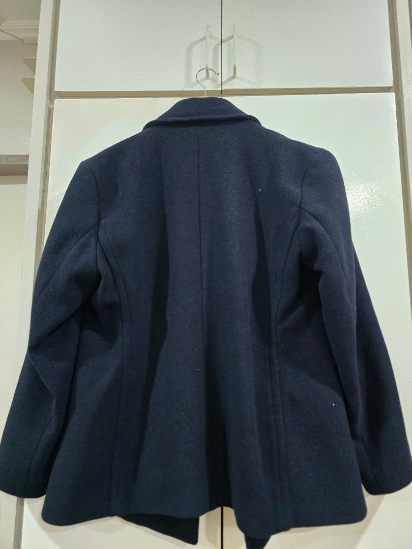 Calliope Navy Blue Wool Blend Peacoat Jacket Size L (Category: Coats, Jackets and Outerwear) located in Paranaque City. Submitted by poandamum (Listing ID 1466352687, Image 2). Description: - Brand/Model: Calliope dark navy blue peacoat - Size: L - Closure & Collar: Double-breasted button closure with notched lapel - Pockets: Two front welt pockets - Material & Interior: Clean wool blend with structured shoulders and fully lined interior - Style/
