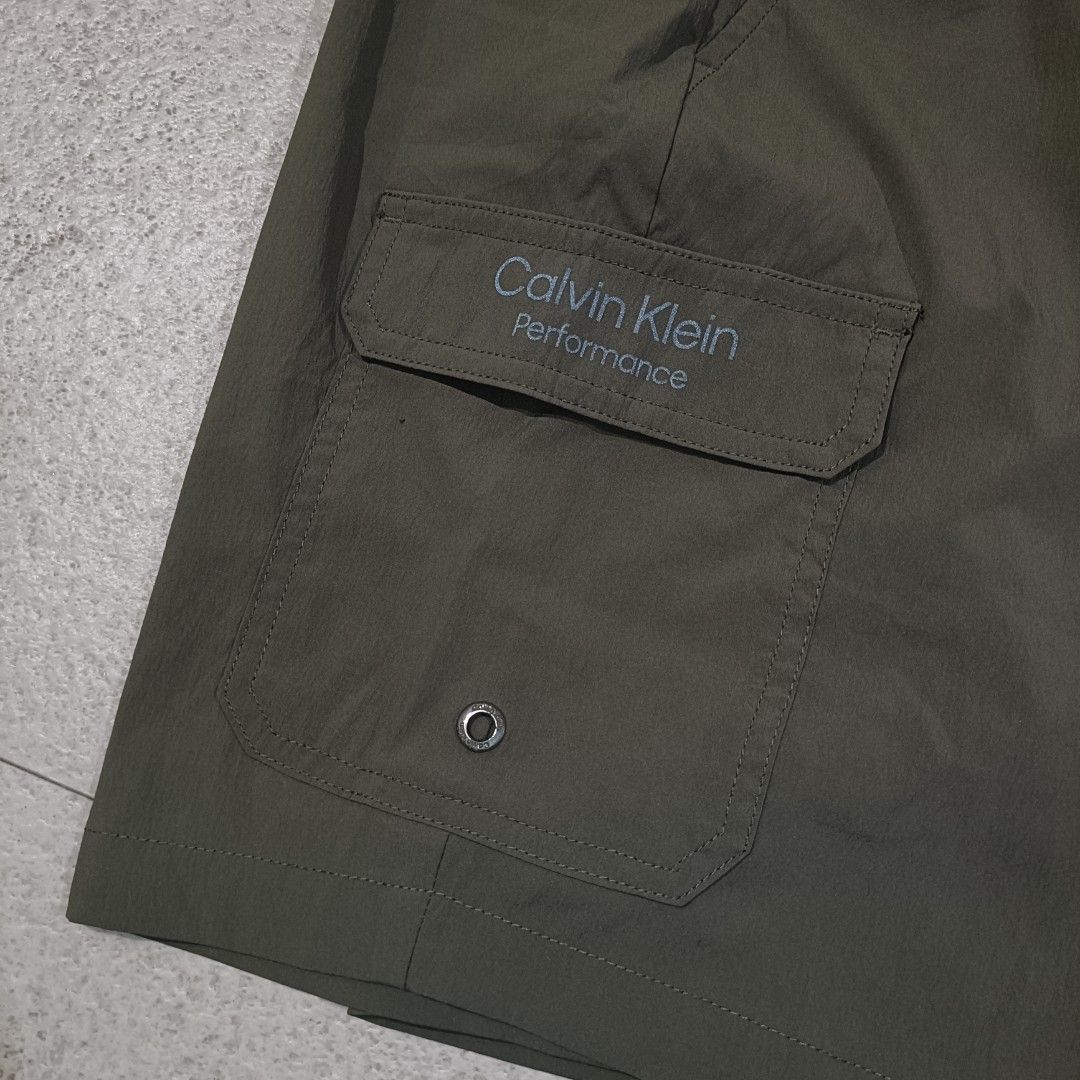 Calvin Klein Olive-Green Nylon short (Category: Shorts) located in Cebu City. Submitted by findwaze6000 (Listing ID 1466526025, Image 3). Description: Excellent condition Size: Small on tag Waistline: Freesize ( garterize w/ laces) Length: 17 Color rate: 10/10 Condition: 10/01 No issue Authentic ✅ DM TO PURCHASE 📩.