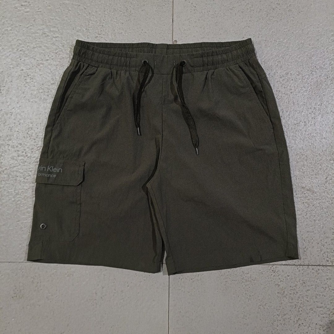 Calvin Klein Olive-Green Nylon short (Category: Shorts) located in Cebu City. Submitted by findwaze6000 (Listing ID 1466526025, Image 2). Description: Excellent condition Size: Small on tag Waistline: Freesize ( garterize w/ laces) Length: 17 Color rate: 10/10 Condition: 10/01 No issue Authentic ✅ DM TO PURCHASE 📩.