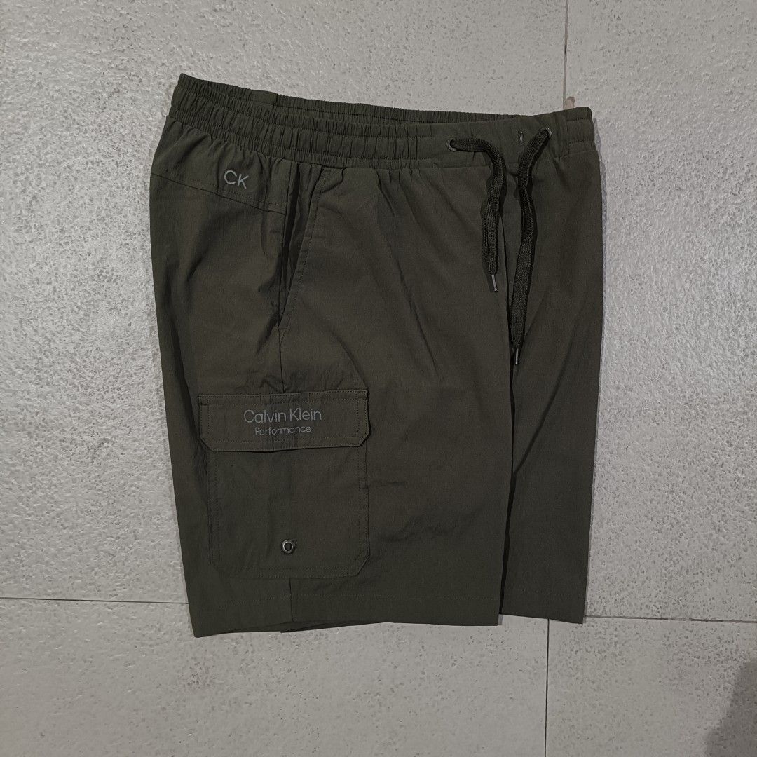 Calvin Klein Olive-Green Nylon short (Category: Shorts) located in Cebu City. Submitted by findwaze6000 (Listing ID 1466526025, Image 1). Description: Excellent condition Size: Small on tag Waistline: Freesize ( garterize w/ laces) Length: 17 Color rate: 10/10 Condition: 10/01 No issue Authentic ✅ DM TO PURCHASE 📩.