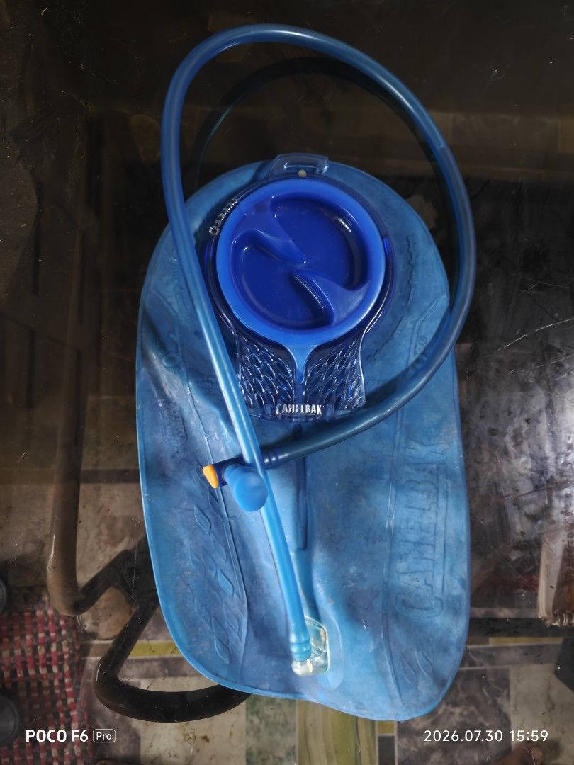 Camelbak Rogue Hydration Backpack (Category: Backpacks) located in Manila. Submitted by eseblud (Listing ID 1466506868, Image 3). Description: Blue Camelbak Rogue hydration backpack including the matching blue water bladder and drinking tube. Blue and dark blue colorway with mesh backing and reflective strap detail. Great for cycling, running, and mountain biking. Used gear with some signs of wear on the fabric and bladder, but fully functional..