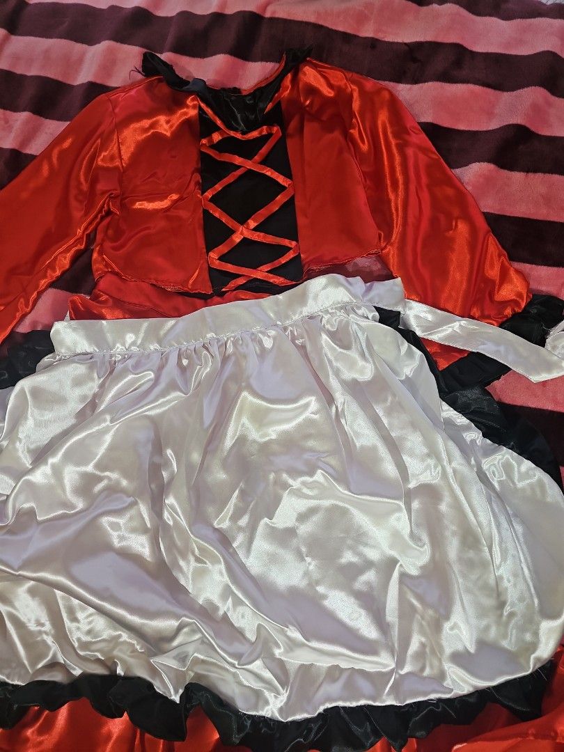 Canada Costume (Category: Babies & Kids Fashion) located in Cainta. Submitted by cyjozuza (Listing ID 1466347723, Image 1). Description: - Vibrant red and black satin dress featuring long sleeves and an eye-catching lace-up bodice - Comes with a glossy white ruffled apron trimmed in black for an authentic look - Made from shiny, high-quality fabric with bright, stunning colors - Equipped with standard tie straps for a comfortable and adjustable f
