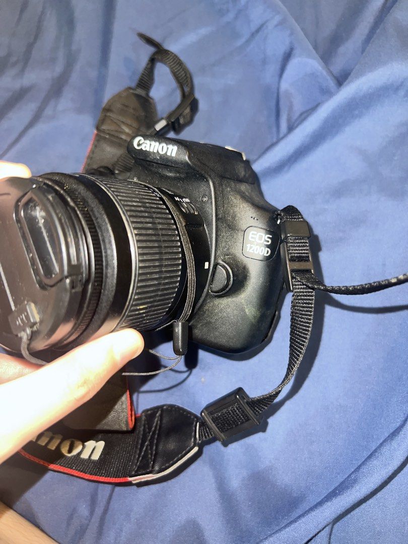 Canon EOS 1200D DSLR Camera (Category: Cameras) located in Paranaque City. Submitted by jaegermisis (Listing ID 1466508902, Image 2). Description: * Comes with original strap * Screen displays settings such as ISO, aperture, and shutter speed * RFS: Not using anymore INCLUSIONS: * Canon EOS 1200D body * Canon lens + cover * Camera bag * Battery + charger CONDITION / DISCLOSURE: * Strap shows normal wear from use * Noticeable crack on the bottom l
