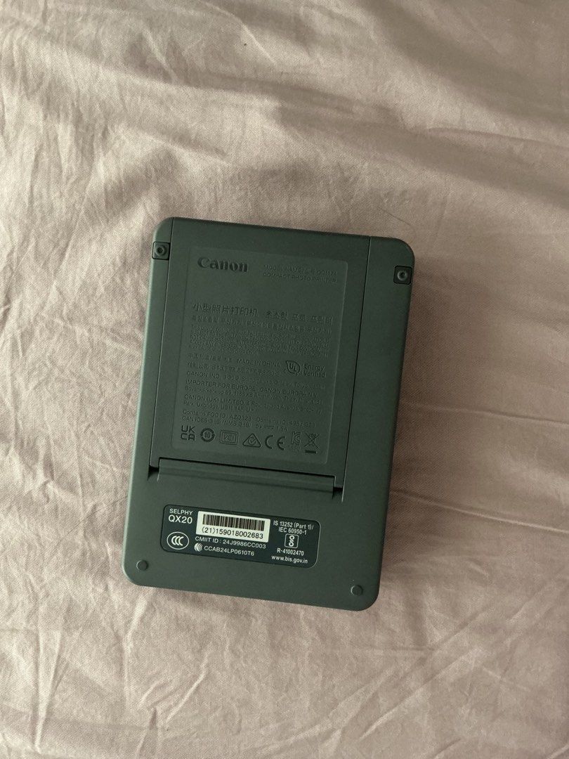 Canon Selphy QX20 Compact Photo Printer Dark Gray (Category: Printers, Scanners & Copiers) located in Quezon City. Submitted by chinchiminni (Listing ID 1466563145, Image 2). Description: - Model: Canon Selphy QX20 compact photo printer in sleek dark gray - Connectivity: Print straight from your phone or mobile device instantly - Charging: Convenient USB-C port with easy-access power button and status lights - Photo Format: Fast printing for high