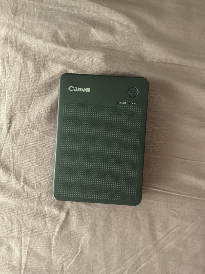 Canon Selphy QX20 Compact Photo Printer Dark Gray (Category: Printers, Scanners & Copiers) located in Quezon City. Submitted by chinchiminni (Listing ID 1466563145, Image 1). Description: - Model: Canon Selphy QX20 compact photo printer in sleek dark gray - Connectivity: Print straight from your phone or mobile device instantly - Charging: Convenient USB-C port with easy-access power button and status lights - Photo Format: Fast printing for high