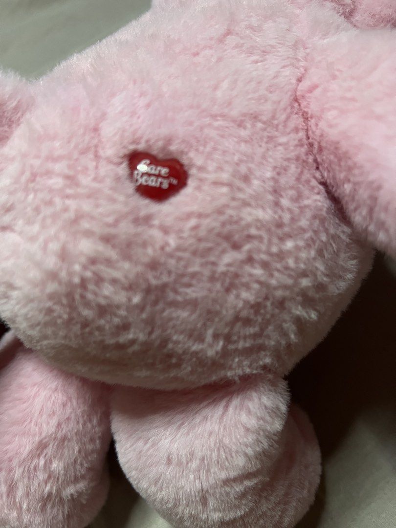 Care Bears Cherry Blossom Pink Bear Plush (Category: Plushies & Soft Toys) located in Bulacan. Submitted by haven_plushie_dolls.888 (Listing ID 1466398666, Image 3). Description: - Official pink Care Bears plush toy - Features a cute cherry blossom flower belly badge - Sweet heart details on feet and red heart on hip - Original tags and store barcode attached - Made with ultra-soft and fluffy material - Clean, pristine condition (from a smoke-fre