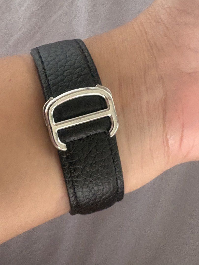 Cartier Tank Watch (Category: Men's Watches) located in Manila. Submitted by mndoxajc (Listing ID 1466064786, Image 3). Description: - Model: Cartier Tank watch - Movement: Battery-operated quartz - Dial: Classic white with Roman numerals and a clean, scratch-free crystal face - Case: Silver-tone stainless steel with stamped Cartier markings, serial numbers, and water-resistance text on the back - Strap: Black textured leather strap with a secure