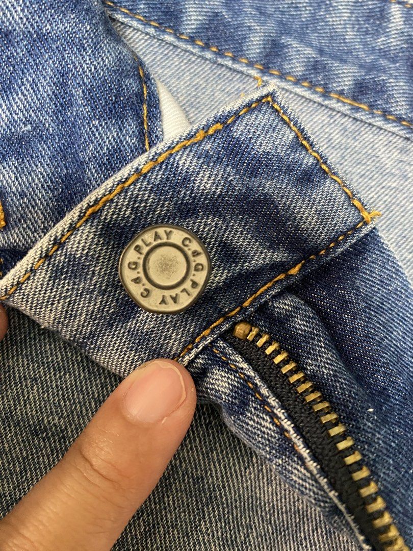 Free SF!!C.d.G. Play Denim Skirt Size M (Category: Skirts) located in Cavite. Submitted by yc.shoppemnl (Listing ID 1466393865, Image 3). Description: - Brand: Comme des Garçons Play - Color: Light blue wash - Size: Medium (M) - Details: Distressed accents near pockets, raw hem, and branded metal button with zip fly - Accent: Iconic small red embroidered heart patch on the right pocket - Condition: Excellent - Waist: size 26 -Length: 16 inches.
