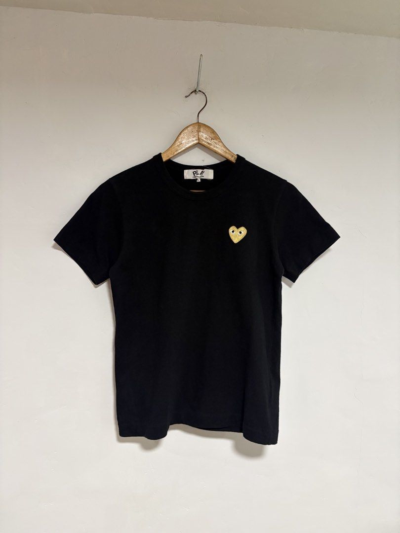 CDG x Play Gold Logo Tshirt (Category: Blouses) located in Manila. Submitted by garbagecollector.2 (Listing ID 1466534916, Image 2). Description: Comme des Garcons x Play Logo Tshirt Made in Japan Excellent Condition Size Large on tag 17.5” pit to pit 23” length.