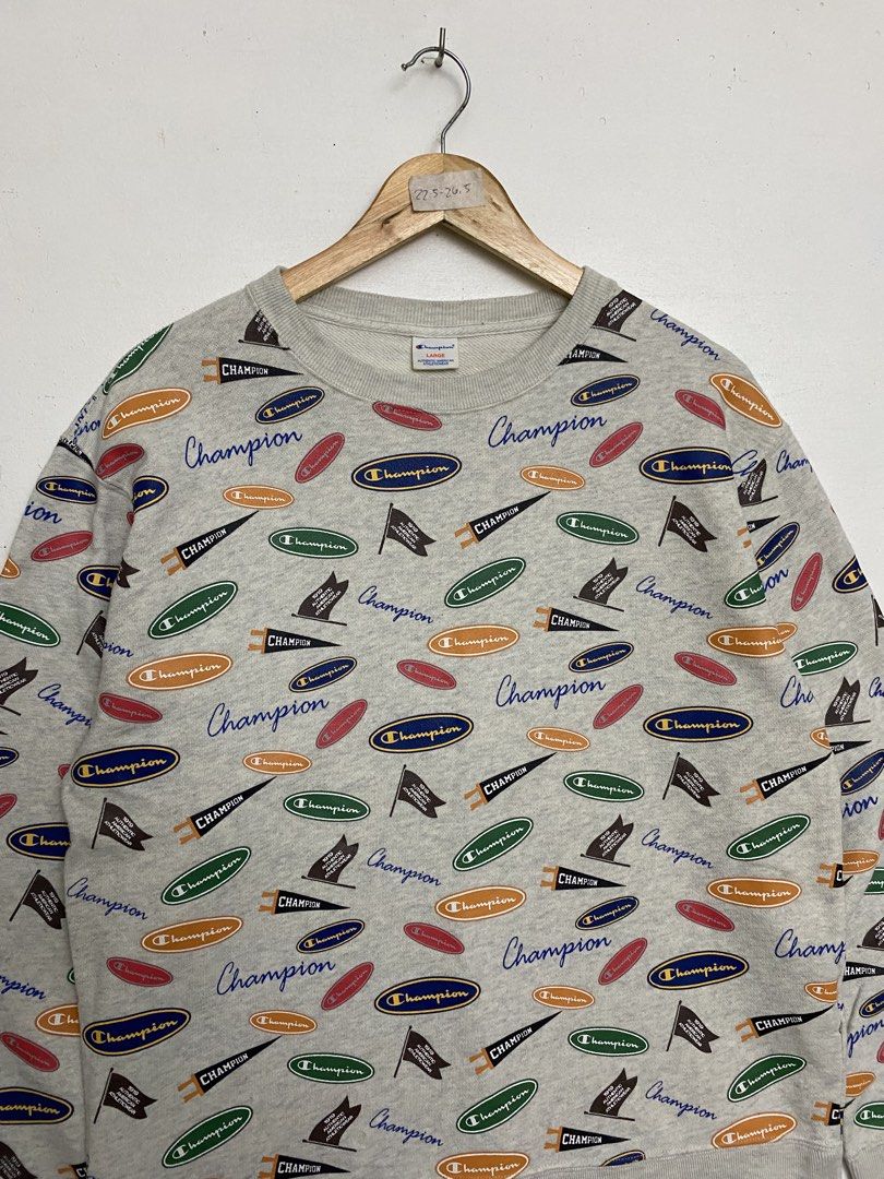 Champion All-Over Print Sweatshirt Gray Size Large (Category: Coats, Jackets and Outerwear) located in Cagayan de Oro. Submitted by stllht (Listing ID 1466450562, Image 2). Description: - Brand: Champion - Style: Crewneck sweatshirt with all-over vintage logo and pennant graphics - Color: Heather Gray - Size: Large - Dimes: 22x26.5 - Material: Cotton and polyester blend - Origin: Made in Cambodia - Condition: Great casual piece, bold retro design