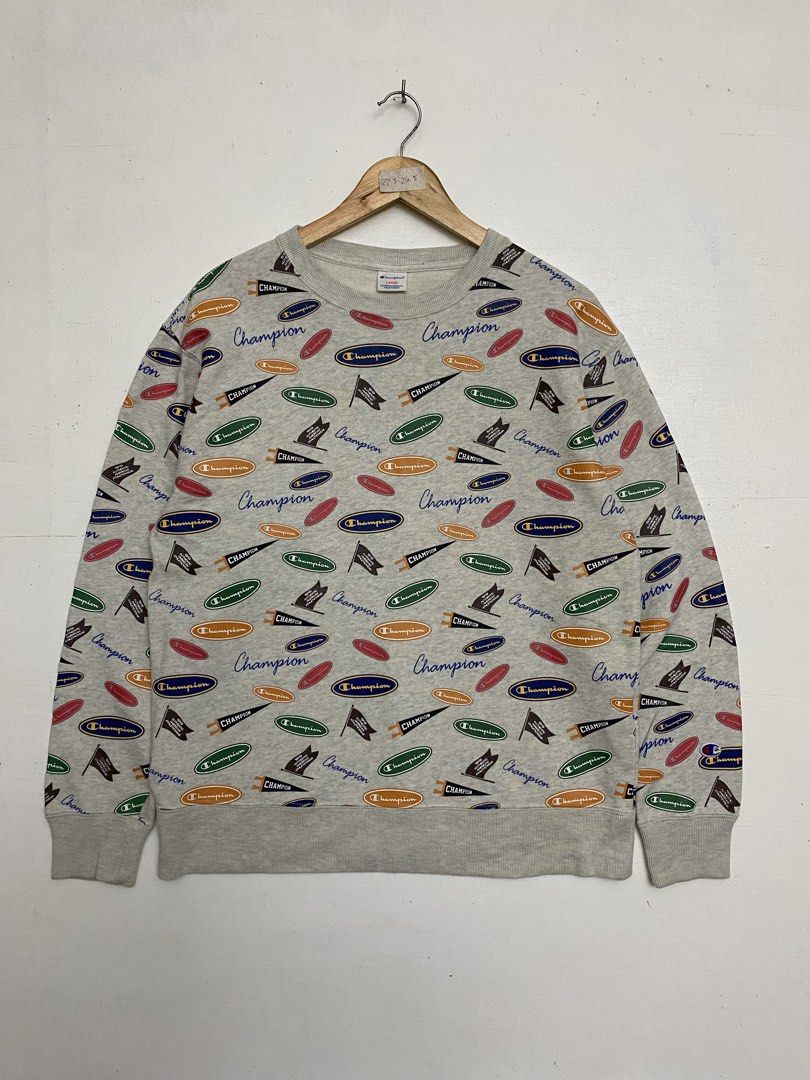Champion All-Over Print Sweatshirt Gray Size Large (Category: Coats, Jackets and Outerwear) located in Cagayan de Oro. Submitted by stllht (Listing ID 1466450562, Image 1). Description: - Brand: Champion - Style: Crewneck sweatshirt with all-over vintage logo and pennant graphics - Color: Heather Gray - Size: Large - Dimes: 22x26.5 - Material: Cotton and polyester blend - Origin: Made in Cambodia - Condition: Great casual piece, bold retro design