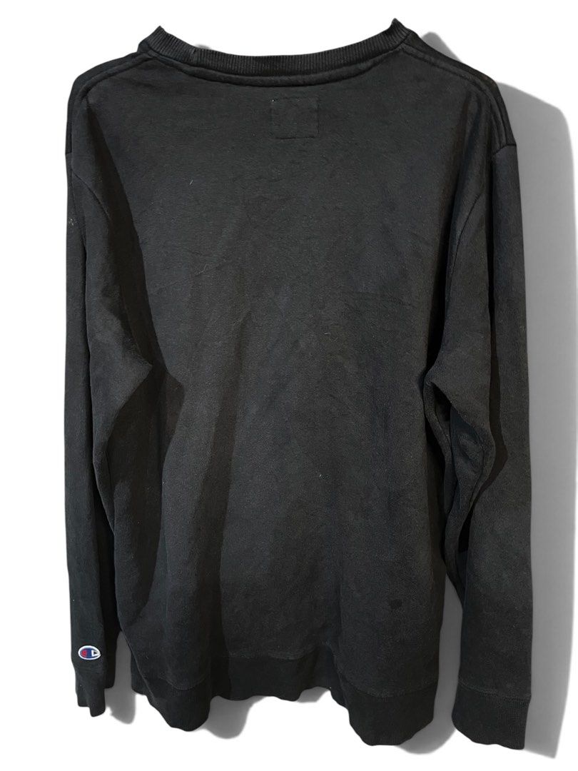 Champion Black Crewneck Sweatshirt (Category: Coats, Jackets and Outerwear) located in Manila. Submitted by matik6 (Listing ID 1466540632, Image 2). Description: Black Champion sweatshirt with embroidered logo script on the chest. Classic crewneck design, long sleeves, ribbed cuffs and hem. Small Champion C patch logo embroidered on the left sleeve cuff. Relaxed everyday fit, comfortable cotton blend fabric. Shows minor fading from regular wear a