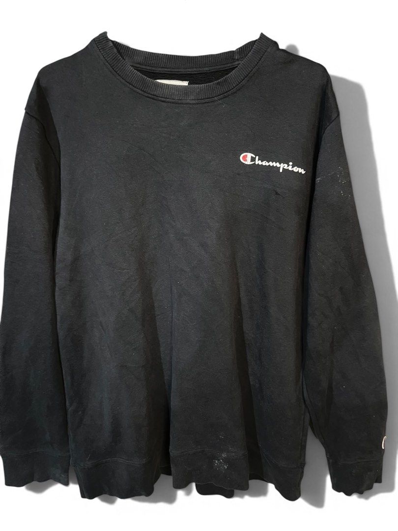 Champion Black Crewneck Sweatshirt (Category: Coats, Jackets and Outerwear) located in Manila. Submitted by matik6 (Listing ID 1466540632, Image 1). Description: Black Champion sweatshirt with embroidered logo script on the chest. Classic crewneck design, long sleeves, ribbed cuffs and hem. Small Champion C patch logo embroidered on the left sleeve cuff. Relaxed everyday fit, comfortable cotton blend fabric. Shows minor fading from regular wear a