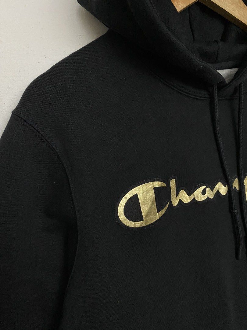 Champion Black Gold Script Logo Hoodie Size Large (Category: Hoodies) located in Cagayan de Oro. Submitted by stllht (Listing ID 1466451605, Image 3). Description: Black Champion hoodie Size Large. Dimes: 24x28 . Metallic gold script logo printed across the chest. Drawstring hood and front kangaroo pocket. Classic ribbed cuffs and hem with the iconic embroidered Champion C logo patch on the left sleeve. Made in Cambodia..
