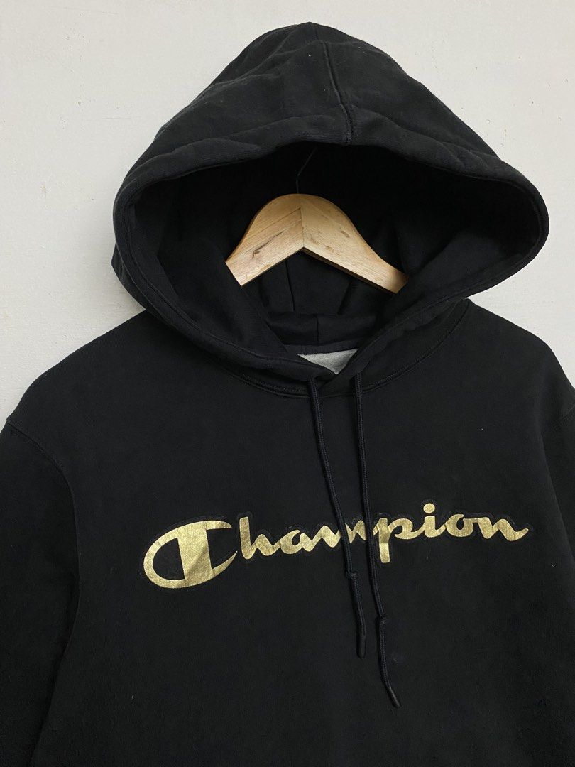 Champion Black Gold Script Logo Hoodie Size Large (Category: Hoodies) located in Cagayan de Oro. Submitted by stllht (Listing ID 1466451605, Image 2). Description: Black Champion hoodie Size Large. Dimes: 24x28 . Metallic gold script logo printed across the chest. Drawstring hood and front kangaroo pocket. Classic ribbed cuffs and hem with the iconic embroidered Champion C logo patch on the left sleeve. Made in Cambodia..