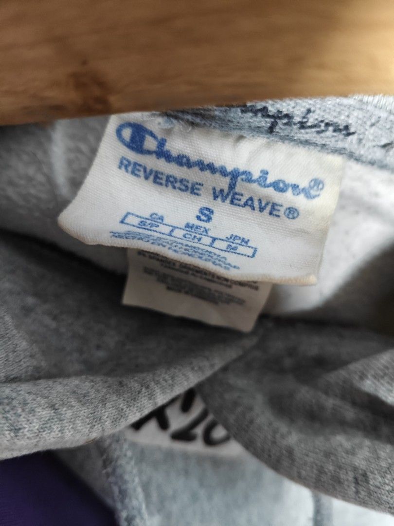 Champion Reverse Weave (Category: Coats, Jackets and Outerwear) located in Rizal. Submitted by itsmecle0 (Listing ID 1466405182, Image 3). Description: • Fabric & Design: Made with heavy-duty cotton fleece using Champion's signature Reverse Weave technology, which prevents vertical shrinkage by cutting the fabric on the cross-grain. • Details: Features ribbed side panels for increased mobility, a front kangaroo pouch pocket, drawstring hood, and 