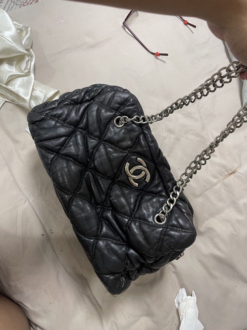 Chanel Black Quilted Leather Shoulder Bag (Category: Luxury Bags & Wallets) located in Taguig. Submitted by 1307maloc (Listing ID 1466397544, Image 2). Description: - Chanel black quilted leather shoulder bag - Soft and puffy exterior texture with silver-tone hardware - Classic interlocking CC logo on the front - Comfortable silver-tone chain strap - Secure top zipper closure - Spacious interior with CC monogram fabric lining and slip pockets Tak