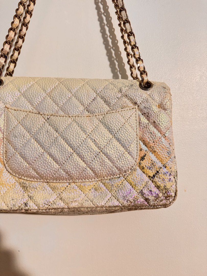 Chanel Quilted Iridescent Flap Bag (Category: Luxury Bags & Wallets) located in Cavite. Submitted by aldrindela40142 (Listing ID 1466536510, Image 3). Description: - Brand: Chanel -sayang talaga to pa restore nyo nalang📌 - Style: Classic Flap Bag - Material: White iridescent leather with silver-tone hardware - Origin: Made in France - Features: Quilted pattern, interwoven chain strap, CC turn-lock closure, quilted CC logo stitching on interior f