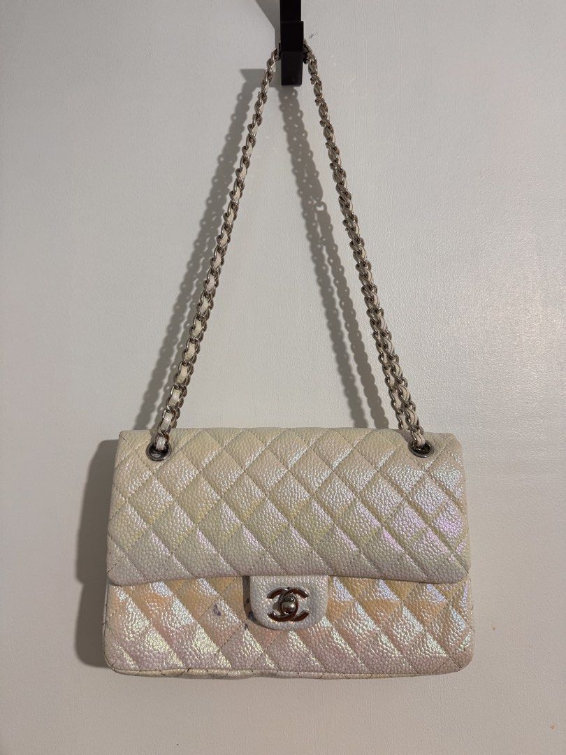 Chanel Quilted Iridescent Flap Bag (Category: Luxury Bags & Wallets) located in Cavite. Submitted by aldrindela40142 (Listing ID 1466536510, Image 1). Description: - Brand: Chanel -sayang talaga to pa restore nyo nalang📌 - Style: Classic Flap Bag - Material: White iridescent leather with silver-tone hardware - Origin: Made in France - Features: Quilted pattern, interwoven chain strap, CC turn-lock closure, quilted CC logo stitching on interior f
