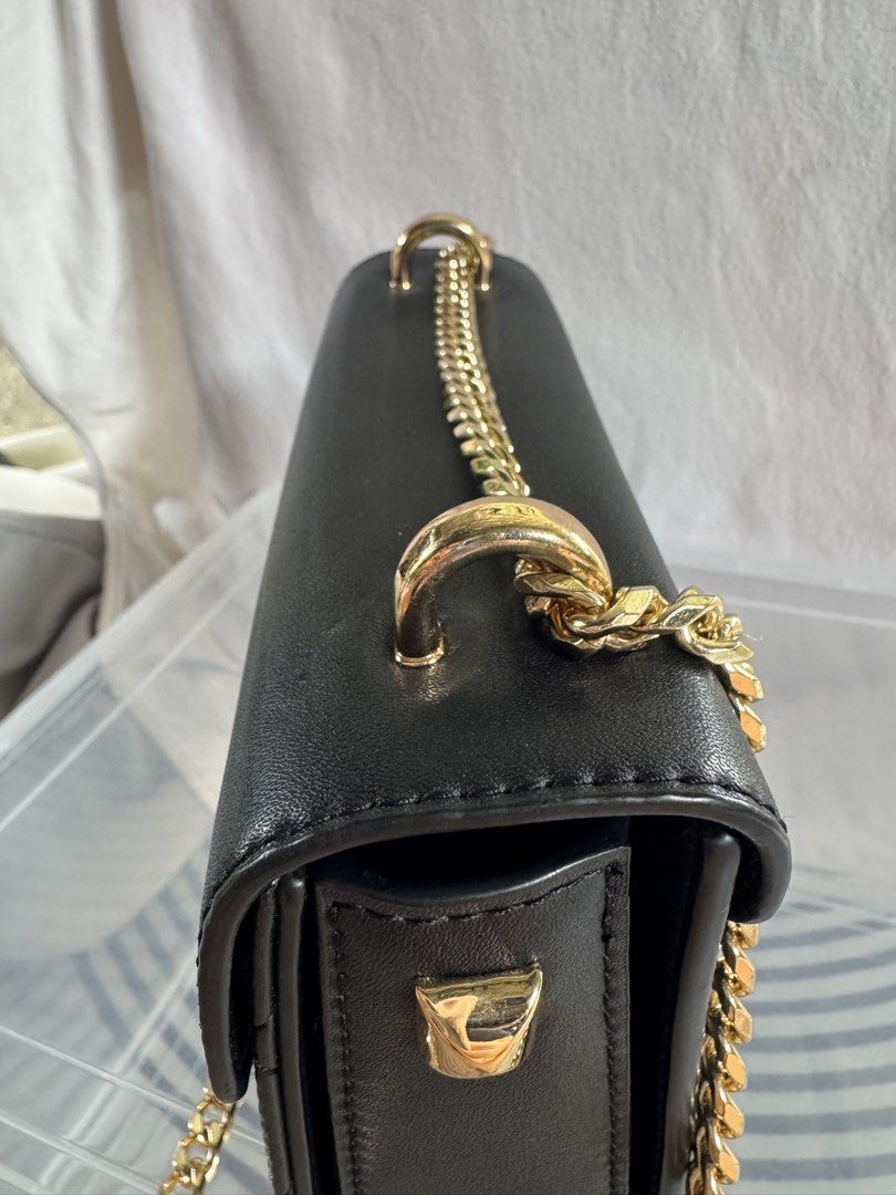 Charles & Keith Black Quilted Shoulder Bag (Category: Cross-body Bags) located in Pagsanjan. Submitted by lavishbyji22912 (Listing ID 1466362854, Image 3). Description: Authentic Charles & Keith bag Super like new papasa brand new No dustbag pero i provided a new one Rfs: d ko na ginagamit Classic black color Quilted diamond pattern Stylish gold-tone hardware Gold chain shoulder strap Front flap with secure clasp closure Compact yet spacious enou