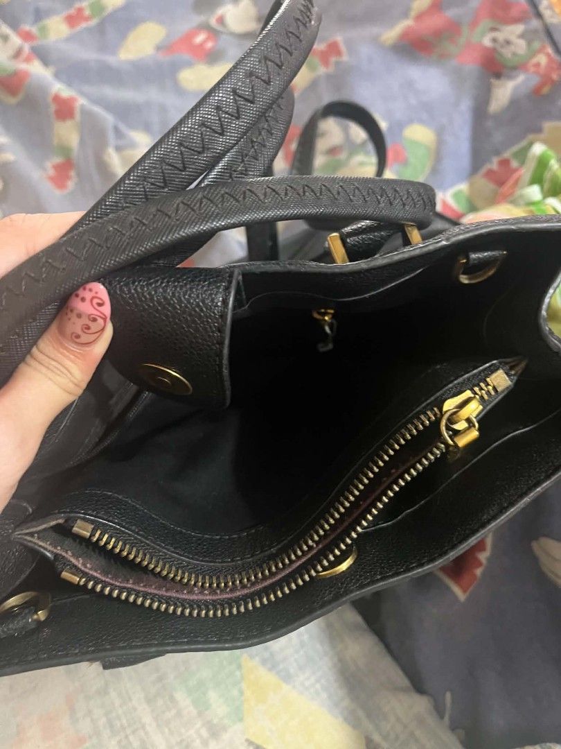 Charles & Keith Black Tote Handbag (Category: Tote Bags) located in Manila. Submitted by margag0o3o76600 (Listing ID 1466473456, Image 3). Description: Black Charles & Keith structured handbag with dual top handles. Gold-tone hardware throughout. Front zip pocket with pull tab. Multiple interior compartments including a zippered middle partition and snap button closure at the top. Clean black lining inside. Classic everyday size for work or casua