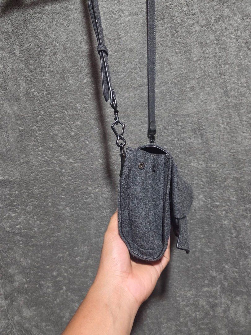 Charles & Keith Grey Felt Bow Crossbody Bag (Category: Cross-body Bags) located in Kidapawan. Submitted by azythrift (Listing ID 1466466379, Image 2). Description: - Brand: Charles & Keith - Color: Elegant grey felt - Design: Large statement bow on front flap with dark gunmetal hardware - Features: Adjustable and detachable shoulder strap with lobster clasps, side snap buttons for adjustable width - Shape: Compact rectangular shape with clean fab
