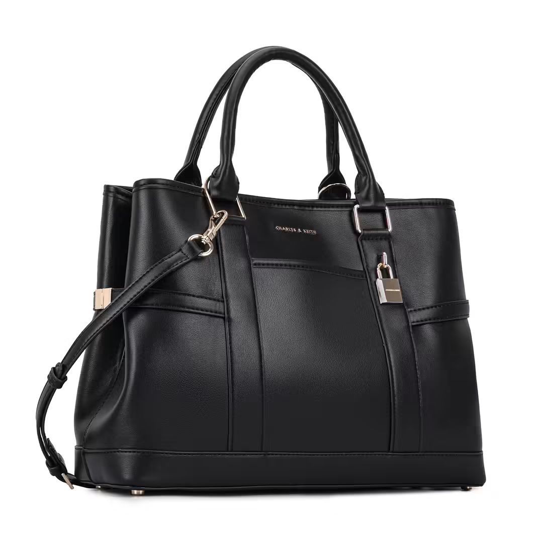 CHARLES & KEITH scottie tote bag Original (Category: Luxury Bags & Wallets) located in Mandaluyong City. Submitted by apparel_jenjo (Listing ID 1466389621, Image 2). Description: Product Description & Features This refined everyday carryall balances modern minimalism with highly functional design elements: • Design Detail: Features vertical paneled stitching, buckled side accents, and a distinct, shiny metallic lock charm hanging from the front h
