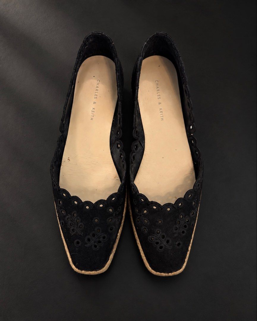 Charles and Keith Espadrille (Category: Flats & Sandals) located in Makati City. Submitted by stylehub.mnl (Listing ID 1466365622, Image 1). Description: 🖤 CHARLES & KEITH | Vintage Black Espadrille Flats A timeless pair for the woman who loves understated details. ✨ Featuring delicate scalloped cutwork, floral eyelet detailing and a classic espadrille-inspired sole. Pre-loved | Size 36 Please check all photos for the actual condition and detail