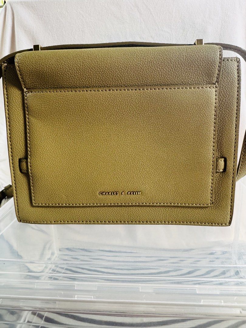 CHARLES AND KEITH GREEN SLING BAG (Category: Cross-body Bags) located in Pagsanjan. Submitted by lavishbyji22912 (Listing ID 1466363770, Image 2). Description: Authentic Charles & Keith bag brand new with tag No dustbag pero i provided a new one Rfs: d ko na ginagamit Super nice nito in person .