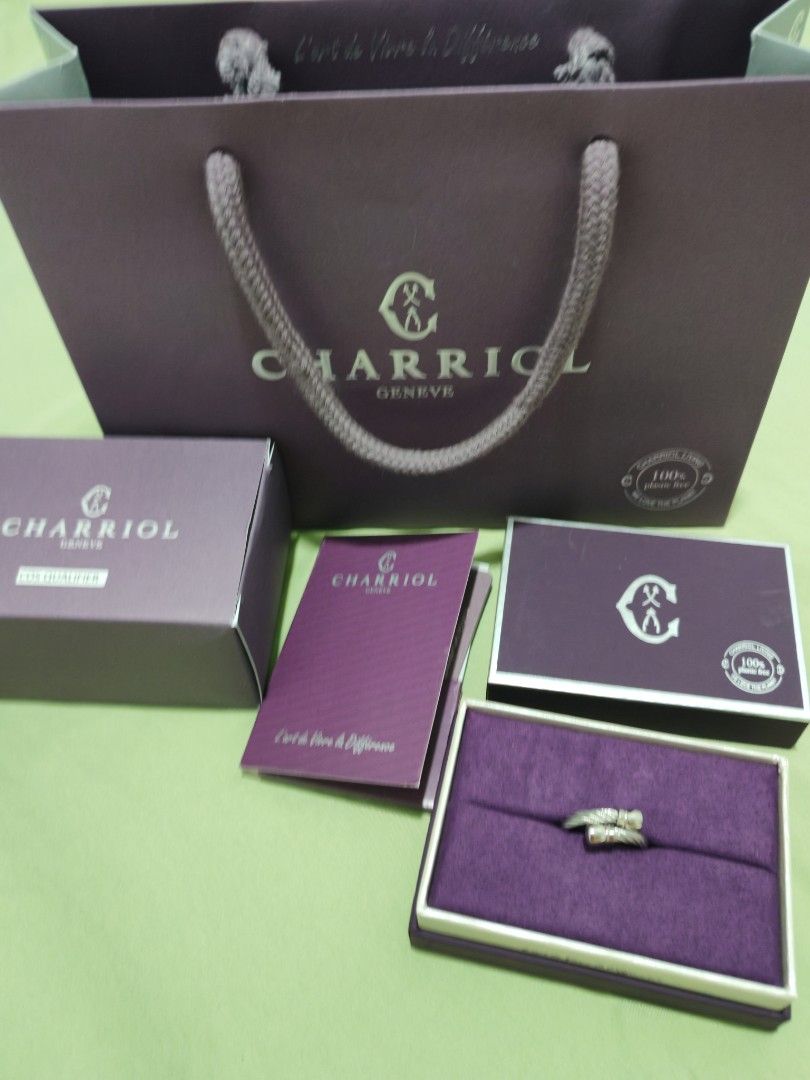 Charriol Geneva Ring with Original Packaging (Category: Rings) located in Quezon City. Submitted by carillepila (Listing ID 1466523859, Image 2). Description: - Authentic Charriol Geneva Ring - Elegant silver-tone finish with iconic twisted cable design and engraved ends - Complete full set: includes purple presentation box, outer box, and paperwork booklet - Bonus: matching Charriol paper gift bag included - Condition is pristine, ideal for gift