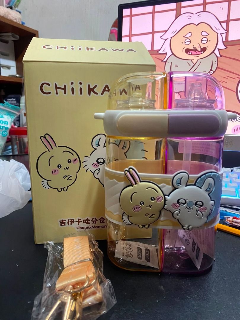 Chiikawa Usagi & Momonga Dual Compartment Water Bottle (Category: Water Bottles & Tumblers) located in Manila. Submitted by xxjjeyyy (Listing ID 1466462612, Image 1). Description: - Authentic Chiikawa water bottle featuring Usagi and Momonga characters - Dual compartment split design allows you to carry two different drinks at the same time - Vibrant yellow and purple sections with adorable silicone character charms - Includes detachable carrying