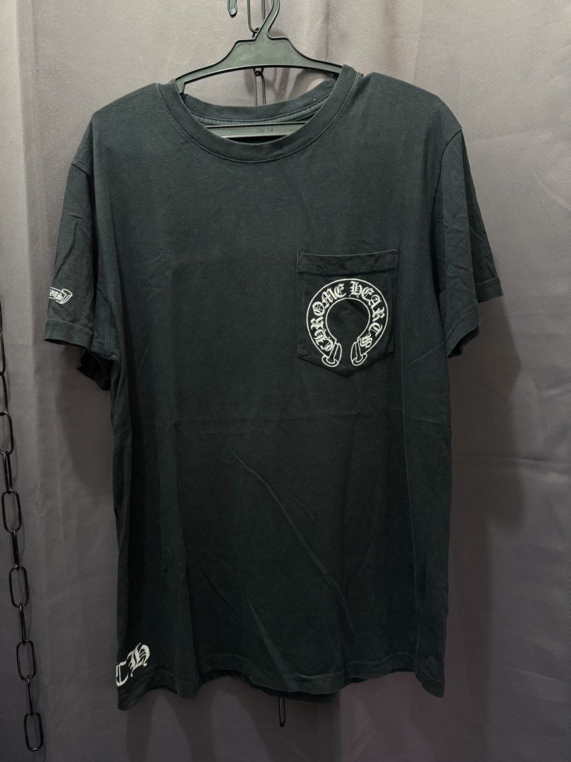 Chrome Hearts (Category: Tshirts & Polo Shirts ) located in Manila. Submitted by craffee00 (Listing ID 1466363113, Image 2). Description: - Authentic Chrome Hearts T-Shirt - Size: Small - Color: Black - Features iconic horseshoe logo on chest pocket - Back graphic: Chrome Hearts logo with ‘Hollywood California U.S.A.’ text - Small logo detail on left sleeve hem - Made in USA.