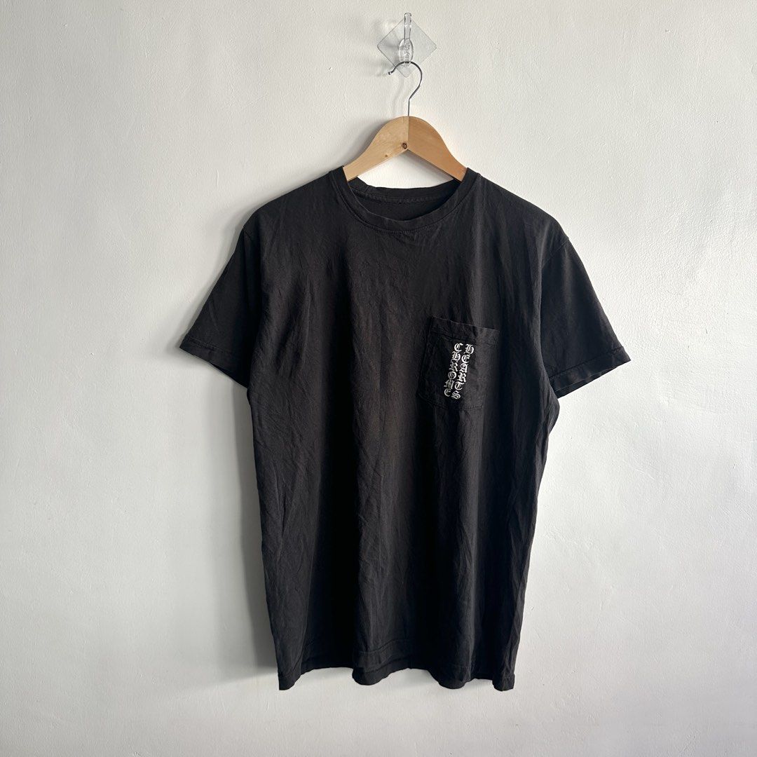 CHROME HEARTS Cemetery Vertical logo Scroll Tee (Category: Luxury Apparel) located in Lemery. Submitted by thesecond_row.ph (Listing ID 1466345193, Image 1). Description: CHROME HEARTS Cemetery Vertical logo Scroll Tee authentic size Large 22” x 28” Condition 8.5/10 Flaws: Shows signs of previous wear, giving the shirt a naturally worn-in vintage character. The graphic has visible cracking throughout the print, adding to its aged and distressed l