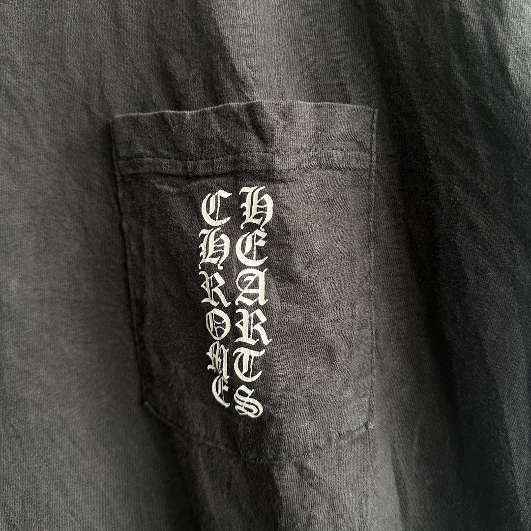 CHROME HEARTS Cemetery Vertical logo Scroll Tee (Category: Luxury Apparel) located in Lemery. Submitted by thesecond_row.ph (Listing ID 1466345193, Image 3). Description: CHROME HEARTS Cemetery Vertical logo Scroll Tee authentic size Large 22” x 28” Condition 8.5/10 Flaws: Shows signs of previous wear, giving the shirt a naturally worn-in vintage character. The graphic has visible cracking throughout the print, adding to its aged and distressed l