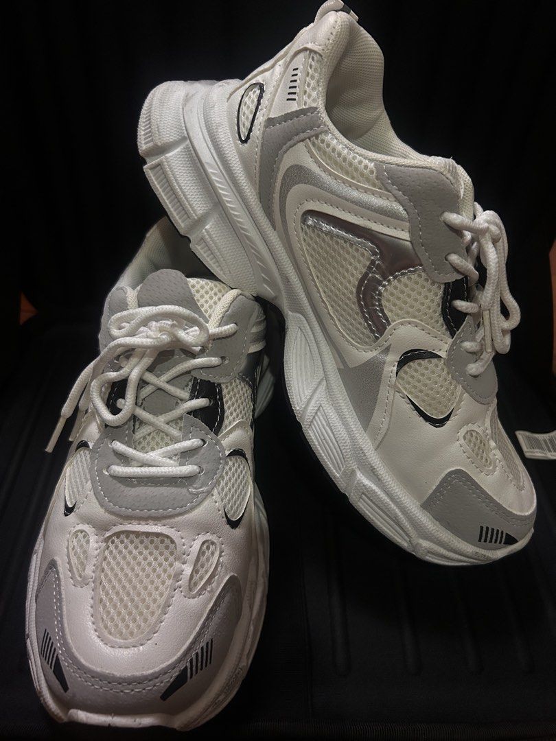 Chunky White and Grey Retro Sneakers (Category: Sneakers) located in Manila. Submitted by ericafelize23 (Listing ID 1466455265, Image 1). Description: - Style: Chunky white sneakers with grey and black accents - Materials: Mesh and leather-like upper panels with a thick black rubber outsole for great traction - Condition: Clean uppers and insoles - Inclusions: Comes with original white laces and shoe trees -No box included.