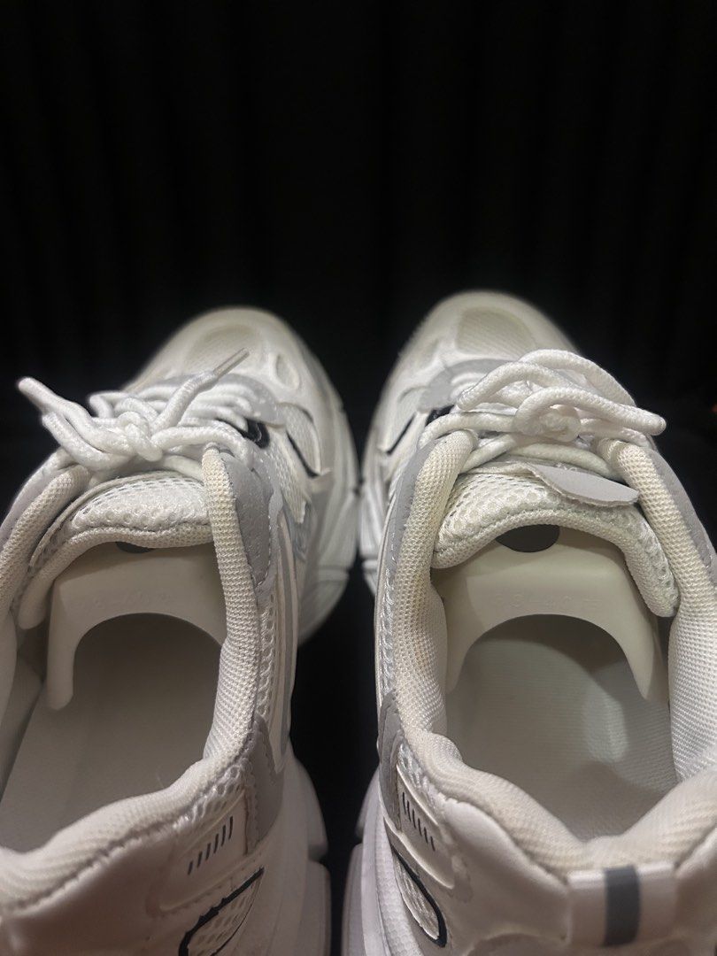 Chunky White and Grey Retro Sneakers (Category: Sneakers) located in Manila. Submitted by ericafelize23 (Listing ID 1466455265, Image 3). Description: - Style: Chunky white sneakers with grey and black accents - Materials: Mesh and leather-like upper panels with a thick black rubber outsole for great traction - Condition: Clean uppers and insoles - Inclusions: Comes with original white laces and shoe trees -No box included.