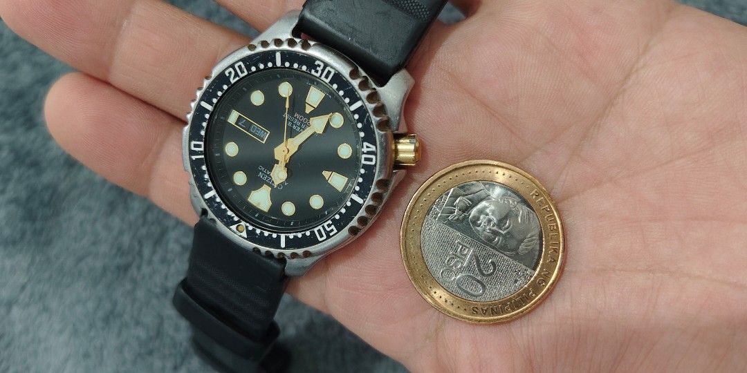 Citizen Promaster 200m ( Made in Japan) (Category: Men's Watches) located in Cebu City. Submitted by aceoftime (Listing ID 1466379750, Image 2). Description: In good condition Made in Japan 21 jewels Ref: 8203-824407 Citizen cal. 8203 mechanical self/hand winding with day-date display ( Non-hacking) Unidirectional rotating bezel Powere reserve up to 45 hours Rated 200m water resist Fitted with 22mm quickfit silicon band Watch only Our Guarantee: 