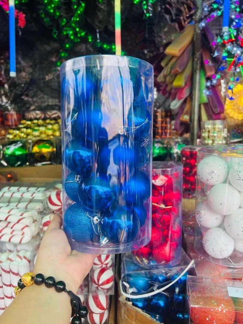 Clear cylindrical container filled with blue Christmas tree babbles (Category: Vases & Decorative Bowls) located in Manila. Submitted by princealmheracalista (Listing ID 1466485360, Image 1). Description: 📦 Bulk order available 🚚 Same-day delivery 📍 NCR / Manila 📩 PM me now!.