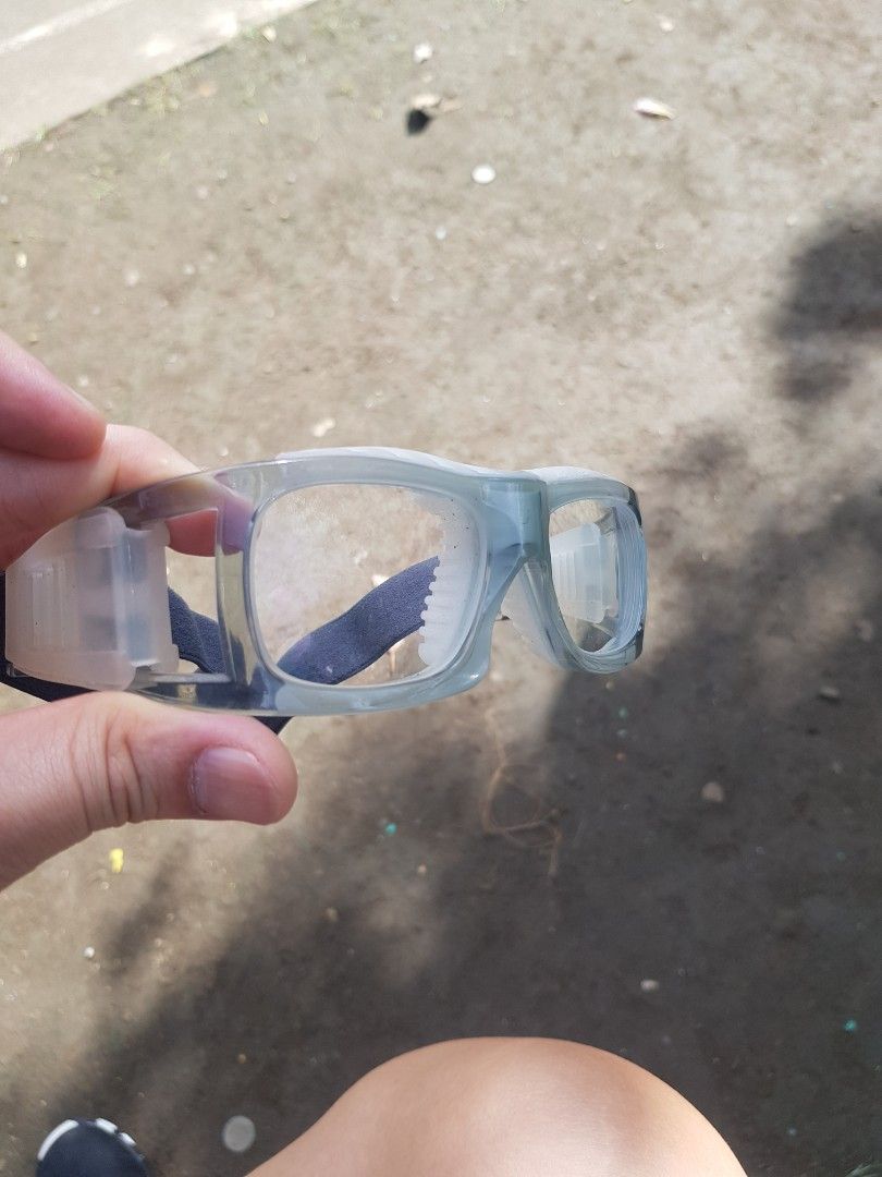 Clear sports goggles with blue elastic strap (Category: Sunglasses & Eyewear) located in Manila. Submitted by anthonylee23810 (Listing ID 1466450595, Image 3). Description: - Clear lenses installed for optimal vision during sports - Padded inner frame for extra comfort and impact absorption - Adjustable blue elastic strap for a secure, snug fit - Ideal for basketball, football, and other high-action sports.