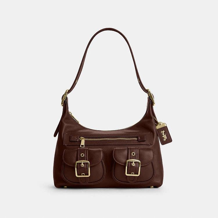 Coach Allison Shoulder Bag in Maple (Category: Shoulder Bags) located in Las Pinas. Submitted by shopwithmira13 (Listing ID 1466356374, Image 2). Description: - Authentic Coach Allison shoulder bag in maple buckle front pockets - Secure zip-top closure with fabric-lined interior - Multiple storage compartments for everyday essentials - Adjustable shoulder strap with buckle details - Comes with a detachable Coach leather hangtag - Perfect daily ba