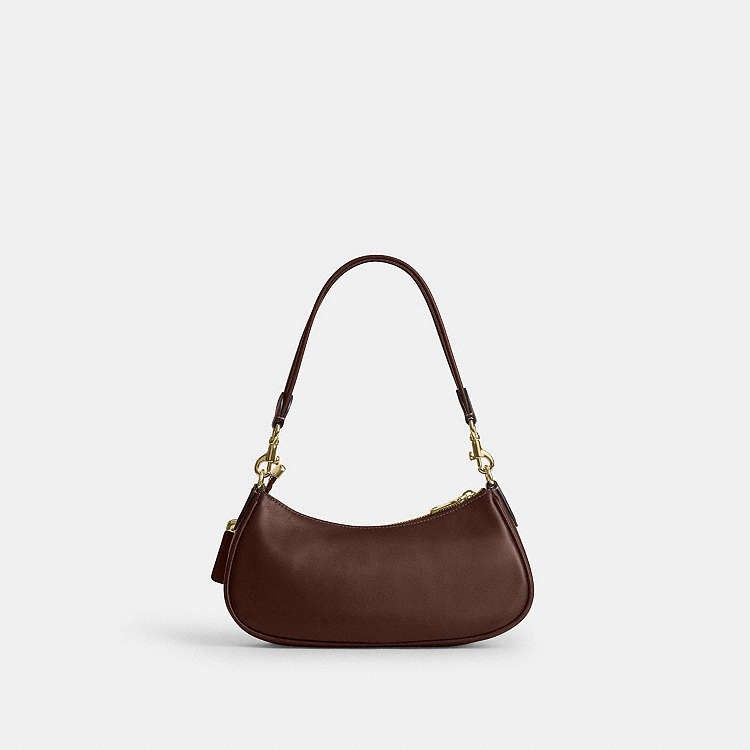 Coach Ashton Shoulder Bag in Maple (Category: Luxury Bags & Wallets) located in Las Pinas. Submitted by shopwithmira13 (Listing ID 1466563091, Image 3). Description: Measurements Length: 10.0" Height: 4.0" Width: 2.75" Materials Natural grain nappa leather Recycled polyester lining Handle Detachable handle with 8.75" drop Strap Detachable strap with 23.25" drop for shoulder or crossbody wear Features Outside magnetic snap pockets Inside multifunc