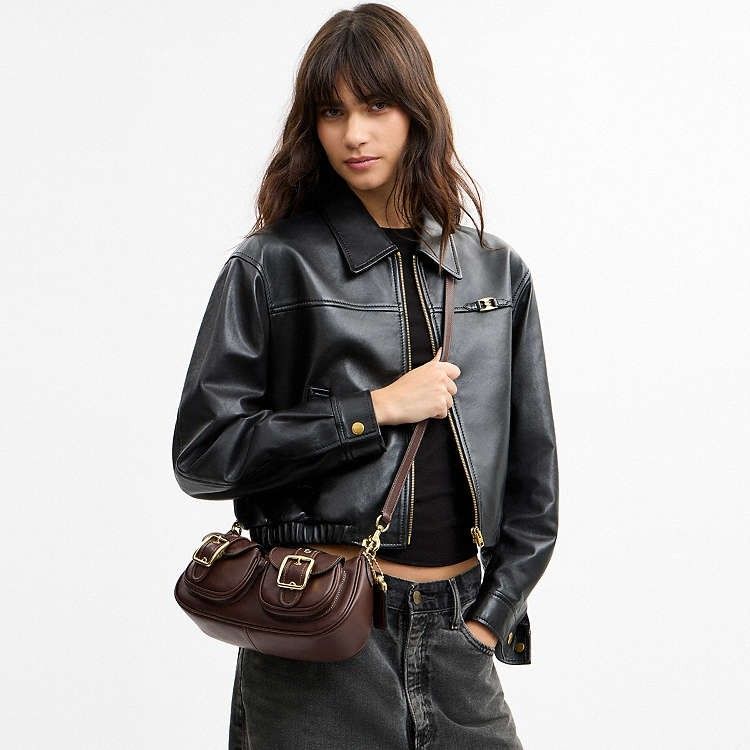 Coach Ashton Shoulder Bag in Maple (Category: Luxury Bags & Wallets) located in Las Pinas. Submitted by shopwithmira13 (Listing ID 1466563091, Image 1). Description: Measurements Length: 10.0" Height: 4.0" Width: 2.75" Materials Natural grain nappa leather Recycled polyester lining Handle Detachable handle with 8.75" drop Strap Detachable strap with 23.25" drop for shoulder or crossbody wear Features Outside magnetic snap pockets Inside multifunc