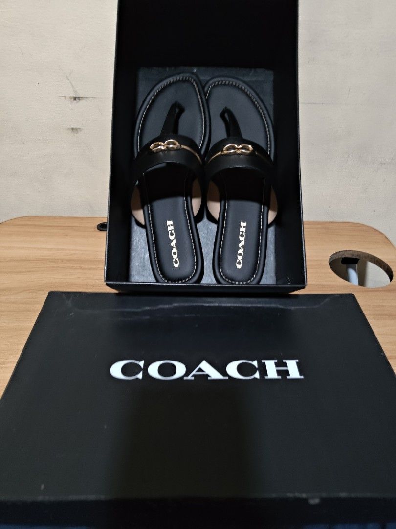 Coach Black Jaala Sandal Size 10 (Category: Flats & Sandals) located in Valenzuela. Submitted by wisewhale_46982b (Listing ID 1466519095, Image 1). Description: - Brand: Coach - Model: Jaala Sandals - Color: Black - Size: US 10 - Condition: Brand new, unworn with original price tag ($168) still attached - Details: Elegant gold-tone hardware on the strap, flat heel, and signature Coach monogram pattern on the sole - Inclusions: Comes with original
