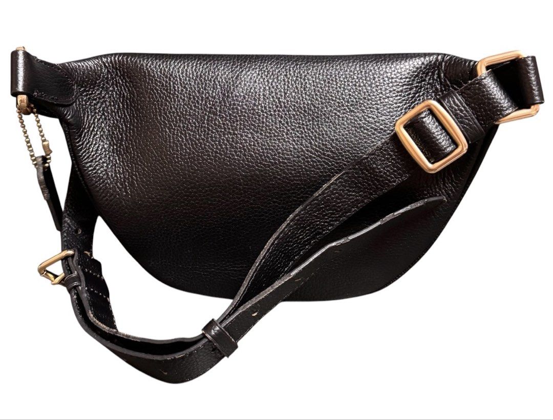 Coach Bum Belt Bag (Category: Belt bags, Clutches and Pouches) located in Baguio. Submitted by pwz-eshop (Listing ID 1466391787, Image 3). Description: • Up for Grabs!! • Guaranteed Authentic!! • Flaws: Some parts of Leather edging has been scraped off. (please see photos) • BRAND: COACH. • DIMENSIONS: length 11", height 6.5", width 3.5", waist 33: 7". • SERIAL NUMBER: With code. • COUNTRY OF ORIGIN: VIETNAM. • MATERIAL: Leather. • COLOR: Black. 