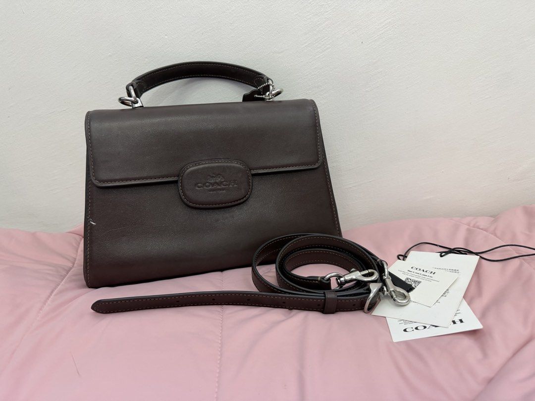COACH ELIZA TOP HANDLE BAG (Category: Luxury Bags & Wallets) located in Batangas. Submitted by ckpanpan184 (Listing ID 1466440729, Image 1). Description: Condition: 9/10 – Excellent condition Details: Minimal scratch on the front area Authenticity: Original from USA 🇺🇸 Inclusions: Comes with sling strap RFS: Decluttering Bought Price: ₱14,000.