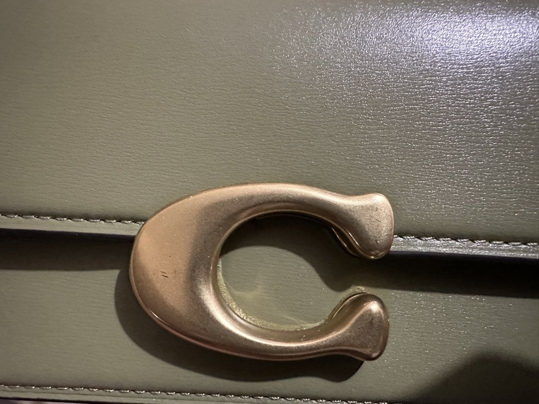 Coach Idol 23 bag (Category: Luxury Bags & Wallets) located in Manila. Submitted by kimmmmy_ (Listing ID 1466550485, Image 2). Description: - Brand: Coach - Model: Idol 23 Bag - Color: Olive Green - Hardware: Gold-tone 'C' clasp - Style: Shoulder bag / handbag with top handle - Condition: Well-maintained and gently used (layered condition 7) - Meetup locations: SM Megamall, Guevent Pickle Club, Robinsons Supermarket California Gardens Mandaluyong