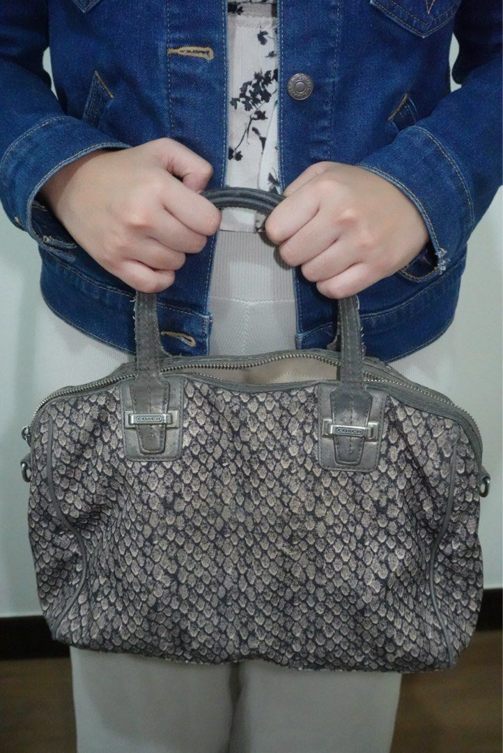 Coach Python Snake Print Satchel Handbag (Category: Luxury Bags & Wallets) located in Manila. Submitted by renkacoleni (Listing ID 1465579963, Image 1). Description: - Authentic Coach satchel bag - Grey and black snakeskin python print fabric body - Dark leather double top handles and trim - Silver-tone hardware with Coach engraved buckle details - Secure zip top closure - Spacious fabric-lined interior - Condition: Excellent / Well-maintained - 