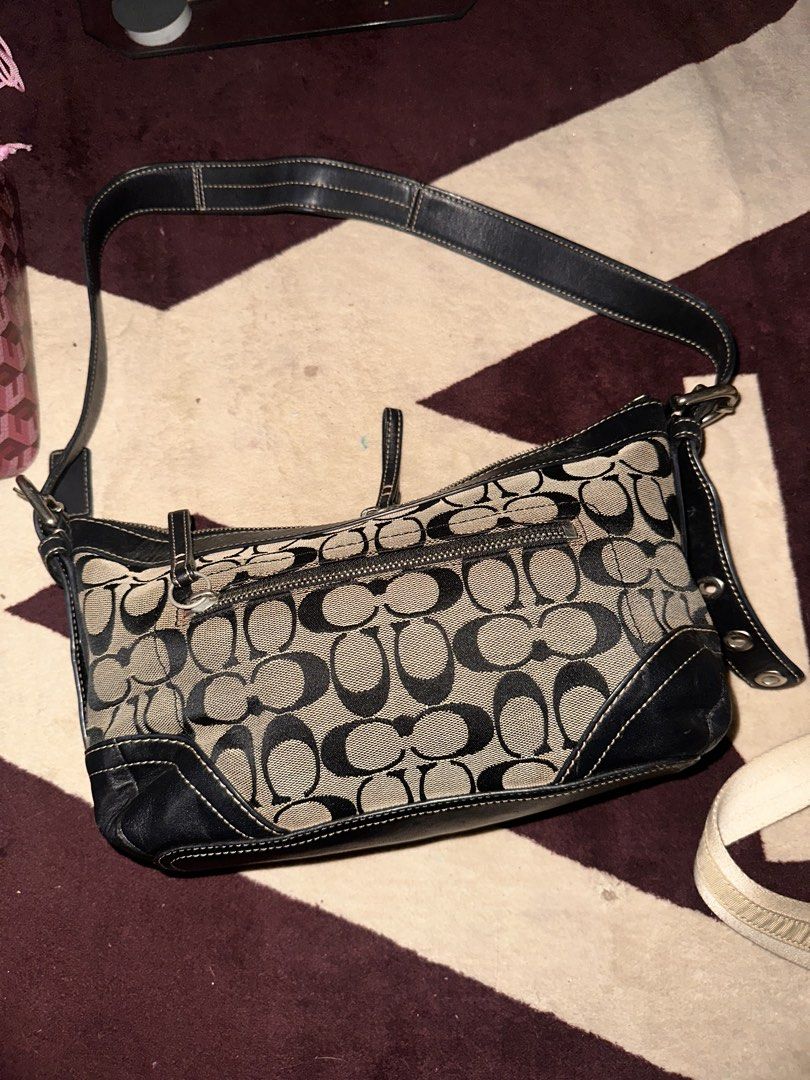 Coach Signature Black and Khaki Shoulder Bag (Category: Luxury Bags & Wallets) located in Manila. Submitted by saturnina89 (Listing ID 1466445865, Image 3). Description: - Authentic Coach signature C print fabric with stylish black leather trim - Secure top zipper closure and convenient exterior front zip pocket - Burgundy fabric-lined interior featuring a slip pocket and traditional creed patch - Comfortable, adjustable black leather shoulder st