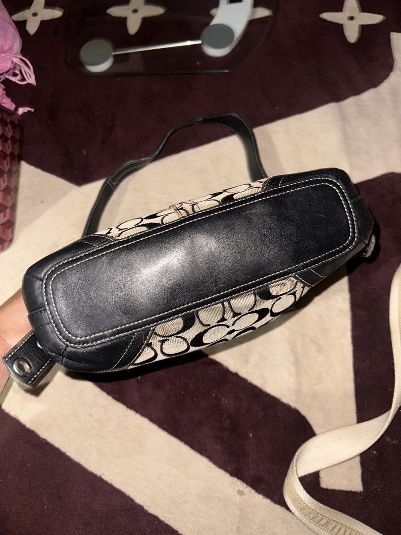 Coach Signature Black and Khaki Shoulder Bag (Category: Luxury Bags & Wallets) located in Manila. Submitted by saturnina89 (Listing ID 1466445865, Image 2). Description: - Authentic Coach signature C print fabric with stylish black leather trim - Secure top zipper closure and convenient exterior front zip pocket - Burgundy fabric-lined interior featuring a slip pocket and traditional creed patch - Comfortable, adjustable black leather shoulder st