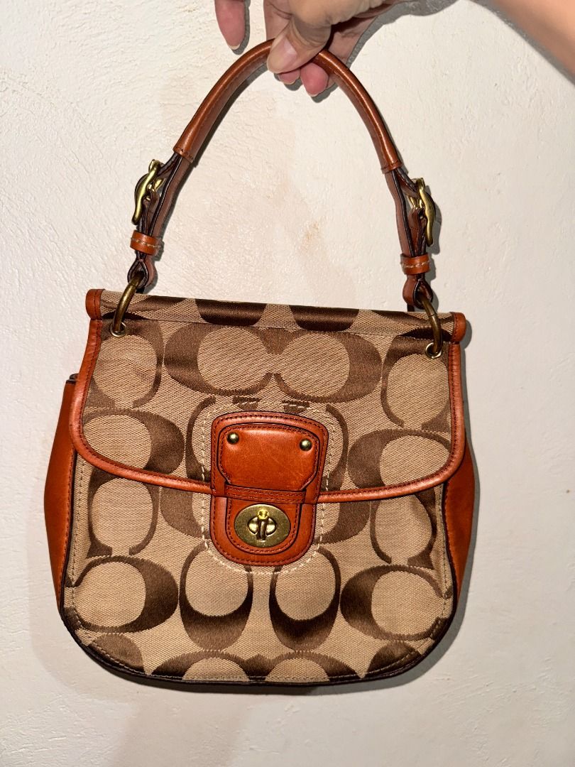 Coach Willis Bag (Category: Luxury Bags & Wallets) located in Dumaguete. Submitted by handpickedby_maria (Listing ID 1466421141, Image 1). Description: Authentic Coach Willis. Features a classic turnlock closure, top handle, and a detachable shoulder strap. Please check each photos. With normal sign of use. May tarnishing sa hardware but it's an easy fix pero yong tarnishing nya para lang din nag blend sa bag. No hang tag. Ganda nito. Walang chis
